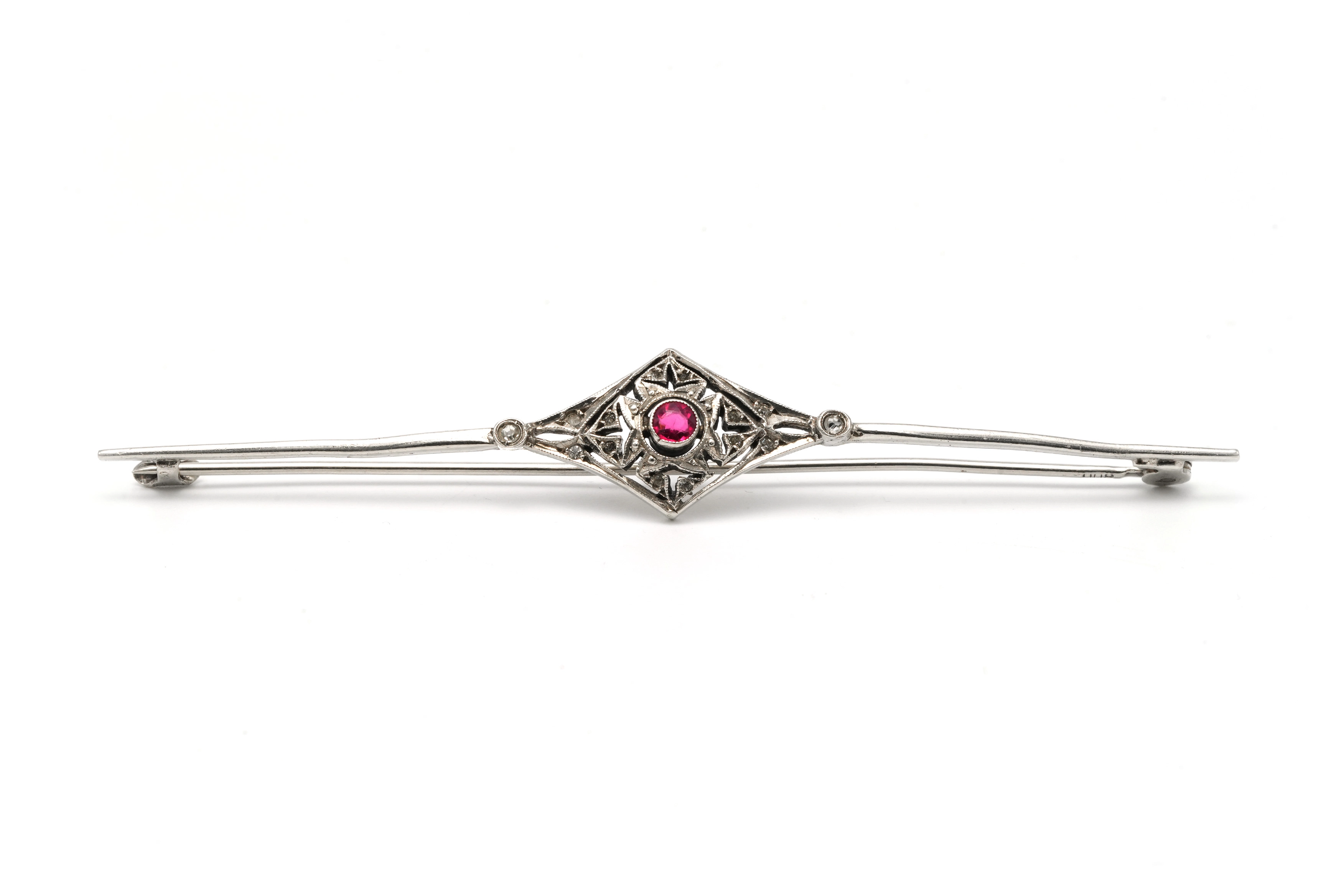 Broche Art Déco en argent 800 sertie d'un rubis et de strass
