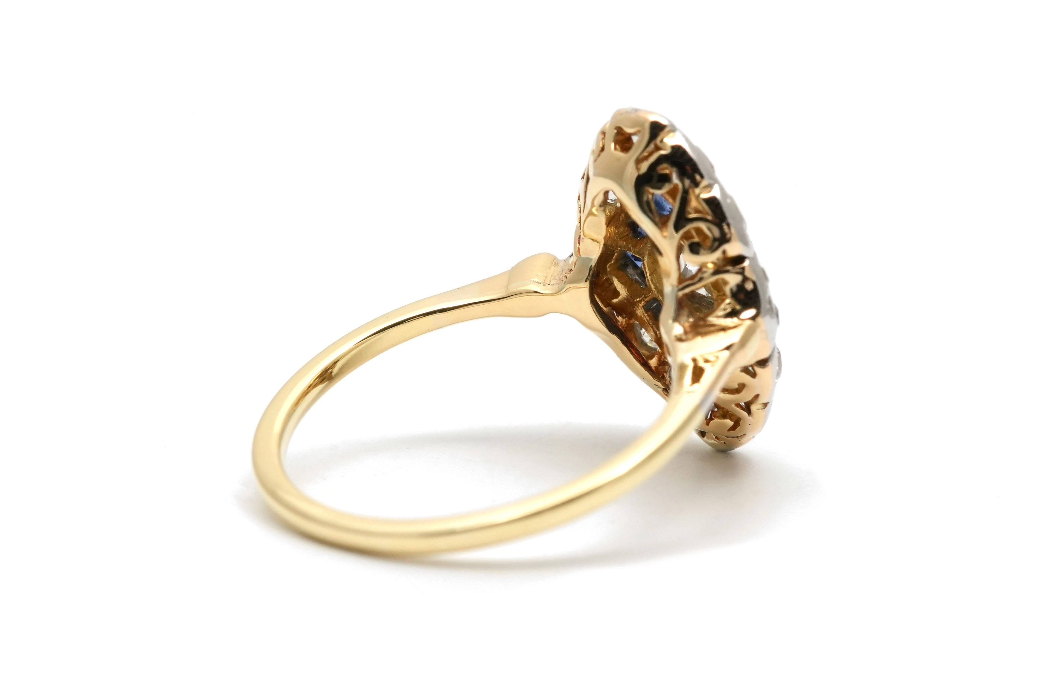 Bague Art Déco en or jaune et blanc 18 carats sertie d'un diamant taille "Old cut", taille "brillant" (+-0.30 ct) et de saphirs