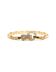 Bracelet Cartier "Agrafe" contemporain en or jaune 18 carats serti de diamants taille "brillant" (+- 1.05 ct) - - 1