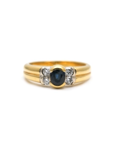 Bague contemporaine en or jaune 18 carats sertie de diamants taille "brillant (+- 0.16ct) et d'un saphir