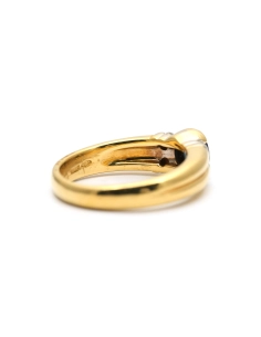 Bague contemporaine en or jaune 18 carats sertie de diamants taille "brillant (+- 0.16ct) et d'un saphir