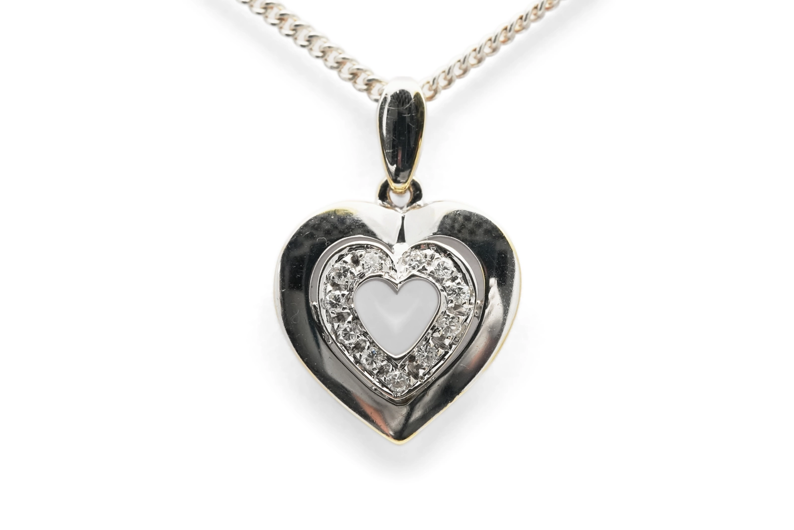 Pendentif cœur contemporain en or blanc 18 carats serti de diamants taille "brillant" (+- 0.12 ct)