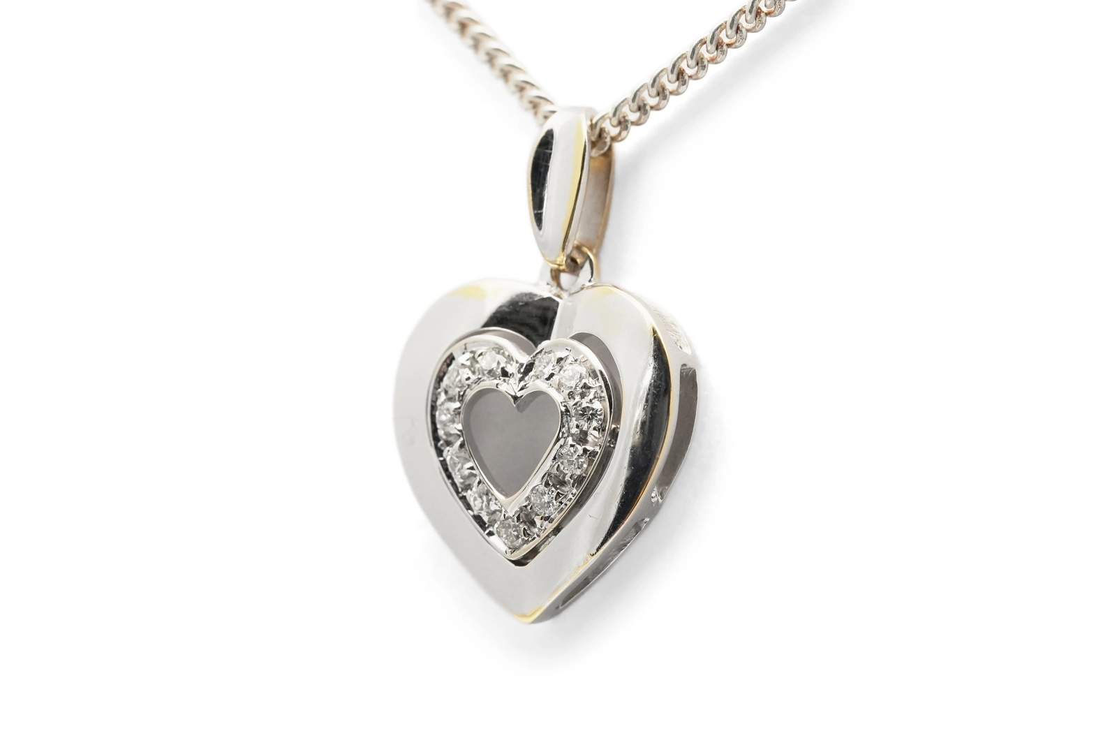 Pendentif cœur contemporain en or blanc 18 carats serti de diamants taille "brillant" (+- 0.12 ct)